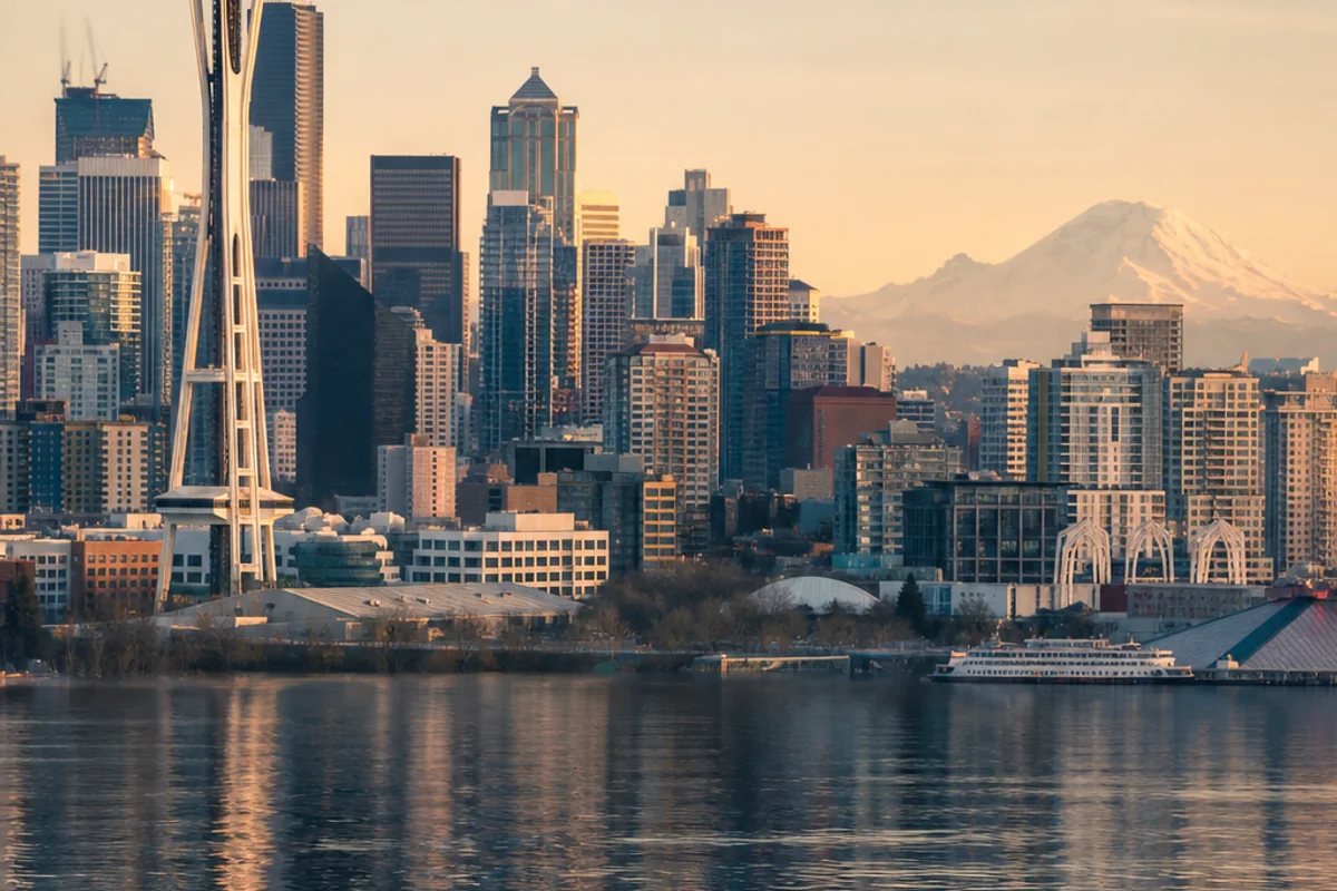 The Seattle skyline with the Space Needle at golden hour over Puget Sound